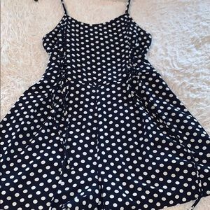 Dark blue romper with white polka dots
